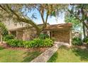 Inviting single-story home with brick facade, manicured landscaping, and a cozy front porch at 409 Oak Haven Dr # 409, Altamonte Springs, FL 32701