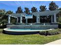 Orchard Hills community entrance featuring a water feature and lush landscaping at 5771 Mangrove Cove Ave, Winter Garden, FL 34787