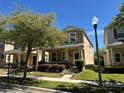Charming home with a well-maintained lawn, sidewalk, and inviting curb appeal at 5771 Mangrove Cove Ave, Winter Garden, FL 34787