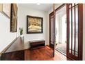 Welcoming entryway with hardwood floors, stylish decor, and a view of the front porch at 6120 Payne Stewart Dr, Windermere, FL 34786