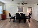 Bright dining room with modern furnishings, neutral color scheme, and updated flooring at 655 Katherine Ave, Orlando, FL 32810