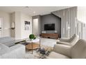 Cozy living room featuring modern decor, neutral color palette, and stylish furniture arrangement at 7376 Oakmoss Loop, Davenport, FL 33837
