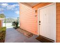 Exterior view of entrance showcasing unit number, well-maintained landscaping, and the inviting front door at 8711 Rockingham Ter # A, Kissimmee, FL 34747