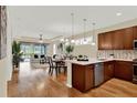Open-concept living space featuring a spacious kitchen, dining area, and comfortable living room at 937 Avery Meadows Way, Deland, FL 32724