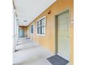 Inviting condo hallway with neutral tones and well-lit entrances at 12527 Floridays Resort Dr # E-111, Orlando, FL 32821