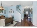 Light-filled dining room with stylish chandelier and dark wood flooring at 1325 Seburn Rd, Apopka, FL 32703