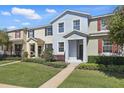 Attractive townhouse with well-maintained landscaping, sidewalk, and front entrance at 1325 Seburn Rd, Apopka, FL 32703