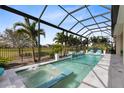 Relax in this fabulous screened-in pool and spa with a water feature and comfortable lounge chairs at 13346 Alderley Dr, Orlando, FL 32832