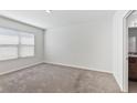 Neutral bedroom with carpet flooring, a window for natural light, and a closet at 16140 Yelloweyed Dr, Clermont, FL 34714