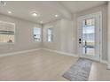 Bright living room featuring recessed lighting, lots of natural light and wood-look tile flooring at 2291 Raven Ridge Rd, Minneola, FL 34715
