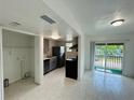 Open-concept kitchen and dining area with updated cabinets and stainless steel appliances at 2751 L B Mcleod Rd # 2751, Orlando, FL 32805