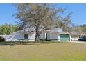 Charming single-story home featuring a lush front lawn and an attached two-car garage at 3275 Deer Lick Ct, Kissimmee, FL 34746