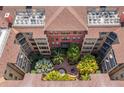 An inviting courtyard featuring lush landscaping and a relaxing atmosphere from an aerial perspective at 911 N Orange Ave # 447, Orlando, FL 32801