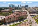 A modern apartment complex in an urban setting near train tracks and downtown buildings at 911 N Orange Ave # 447, Orlando, FL 32801