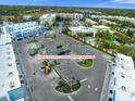 Ample parking lot for retail, garage apartment, and visitors is well-lit and beautifully landscaped at 927 City Walk Ln, Oviedo, FL 32765