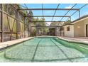 Inviting screened-in pool and spa area perfect for relaxing and entertaining outdoors in privacy at 1072 Weaver Dr, Oviedo, FL 32765