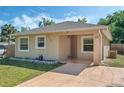 Inviting home with neutral paint, well-placed windows, and a covered front entry at 1101 S Thompson Ave, Deland, FL 32720