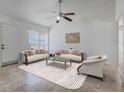 Bright living room featuring tile floors, neutral walls, and lots of natural light at 1101 S Thompson Ave, Deland, FL 32720