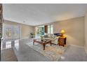 Spacious living room with polished floors, comfortable seating, and natural light at 1821 Mohican Trl, Maitland, FL 32751