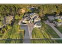Expansive property with lush landscaping, long driveway, and mature trees in a serene neighborhood at 4205 Clarice Ct, Windermere, FL 34786