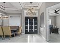 Grand foyer with high ceilings, designer lighting, and stylish double doors offers a welcoming entrance at 4205 Clarice Ct, Windermere, FL 34786