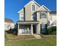 Two story home features a cozy front porch and well-manicured lawn at 8989 Lee Vista Blvd # 2106, Orlando, FL 32829