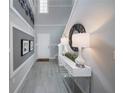 Stylish foyer with high ceilings, decorative lighting, and gray floors at 1234 Sand Torch Cir, Davenport, FL 33837