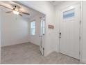 Bright entryway with modern tile flooring and convenient key hooks at 14007 Picard Aly, Winter Garden, FL 34787