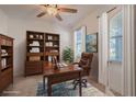 Stylish home office featuring a wood desk, shelving, and a comfortable leather chair at 14007 Picard Aly, Winter Garden, FL 34787