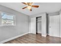 Cozy bedroom with hardwood floors, closet, white trim and fresh paint at 1607 India Palm Dr, Edgewater, FL 32132