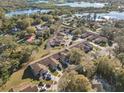 Aerial view of a residential community nestled among trees, close to a serene lake at 205 Hill St # 205, Casselberry, FL 32707