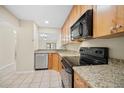 Well-lit kitchen showcasing modern appliances, granite countertops, and ample cabinet space at 205 Hill St # 205, Casselberry, FL 32707