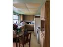 This kitchen features natural wood cabinets and vintage appliances at 209 Whippoorwill Dr, Altamonte Springs, FL 32701