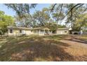 Expansive backyard featuring a shed, covered parking, and ample space for recreation and relaxation at 2204 Votaw Rd, Apopka, FL 32703