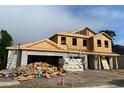 Exterior view of a home under construction with visible wood framing and cinder block base at 2430 Francisco Art Ct, Oviedo, FL 32765