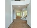 Open foyer with hardwood floors, staircase, and plenty of natural light at 2430 Francisco Art Ct, Oviedo, FL 32765