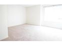 Bright bedroom featuring neutral carpet, a large window, and ample natural light at 2936 Antique Oaks Cir # 71, Winter Park, FL 32792