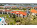 Beautiful aerial view of condo community with multiple buildings and waterfront access at 445 Bouchelle Dr # 104, New Smyrna Beach, FL 32169