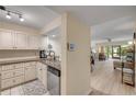 Charming kitchen with granite countertops and white cabinetry, perfect for any home chef at 445 Bouchelle Dr # 104, New Smyrna Beach, FL 32169