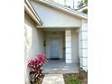 Inviting front entrance with a stylish blue door and decorative columns at 4618 Prairie Point, Kissimmee, FL 34746