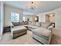 Bright living room features a large sectional sofa and contemporary lighting at 489 Water St # 489, Celebration, FL 34747