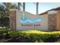 Fountain Park community signage with stone accents surrounded by landscaped bushes at 8878 Conway Rd, Polk City, FL 33868
