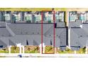 Overhead view of townhomes featuring screened-in pools, dark grey roofs, and manicured landscaping at 2636 Reading Trl, Kissimmee, FL 34746