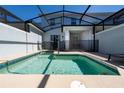 Private, screened-in pool area with clear water, patio furniture, and a safety fence for worry-free enjoyment at 2636 Reading Trl, Kissimmee, FL 34746