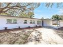 Inviting home featuring a freshly painted white brick facade, and covered carport at 3434 Se 12Th St, Ocala, FL 34471
