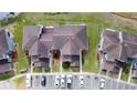 Birds eye view of townhouses with parking and well-maintained landscaping at 373 Caribbean Dr, Davenport, FL 33897