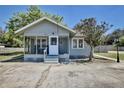 Exterior view of a quaint home featuring a charming screened-in front porch at 3807 S Sanford Ave, Sanford, FL 32773