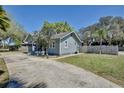 Charming house with a cozy screened porch, nice lawn, and mature trees at 3807 S Sanford Ave, Sanford, FL 32773