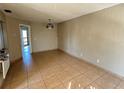 Empty living room with tile floors and neutral walls at 4358 Aqua Vista Dr # G, Orlando, FL 32839