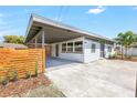 Charming single-story home featuring a carport, modern fence, and well-maintained landscaping, offering curb appeal at 4429 Rossmore Dr, Orlando, FL 32810